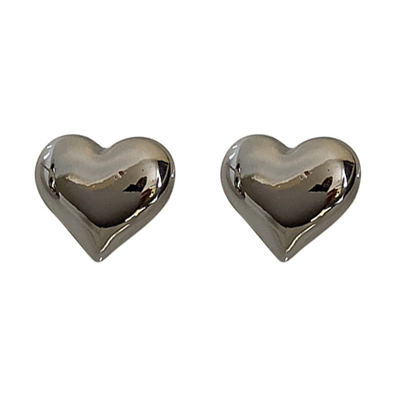 Boucles d'oreilles en forme de cœur tridimensionnelles en métal simple, conception d'intérêt particulier