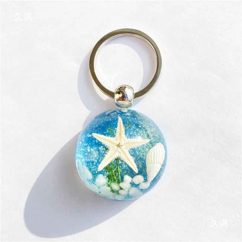 Colgante de llavero de ámbar de estrella de mar