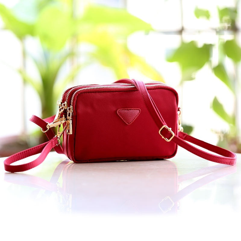 Mini sac carré à triple fermeture éclair