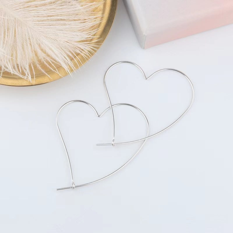 Boucles d'oreilles creuses en forme de cœur, personnalité gracieuse à la mode