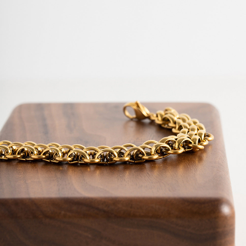 Bracelet pour femme à chaîne géométrique en acier titane et or 18 carats