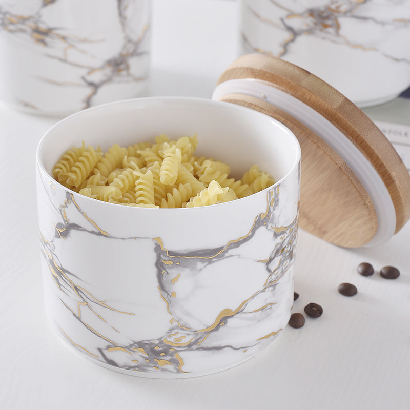 Tarro hermético con tapa de madera de cerámica veteada.