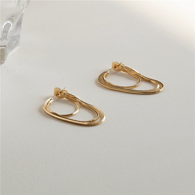 Boucles d'oreilles simples de style froid pour femmes
