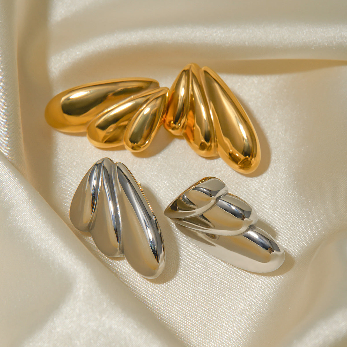 Boucles d'oreilles ailes en acier inoxydable or 18 carats Geometry