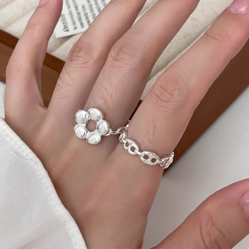 Bague de fleur creuse simple à cinq pétales