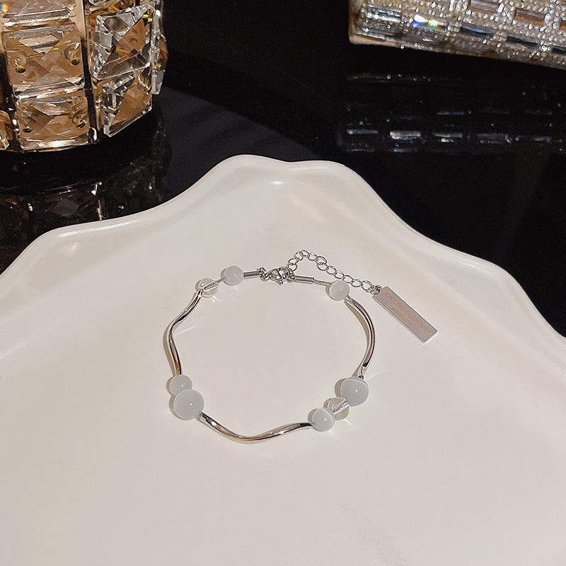 Pulsera versátil de perlas y flores de circón