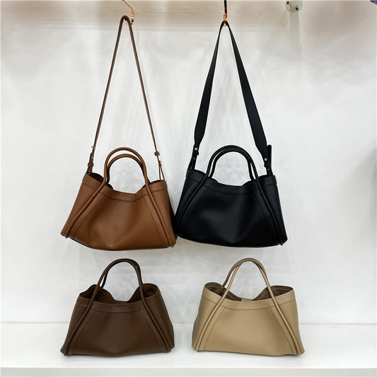 Combinación de transporte de mano tipo bandolera de cuero suave con patrón de lichi