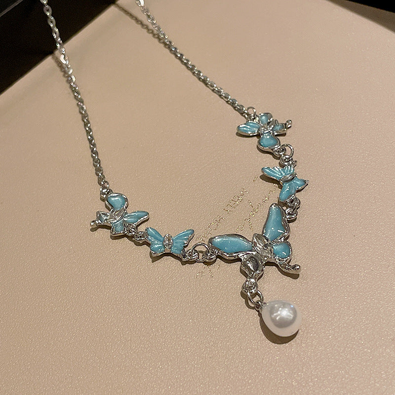 Collier de perles en strass papillon froid