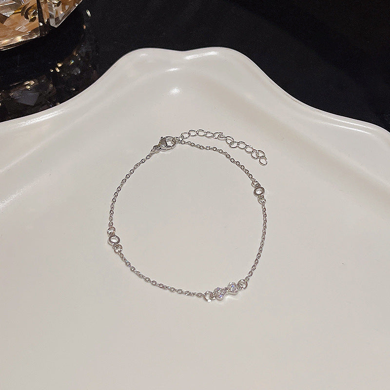 Pulsera versátil de perlas y flores de circón