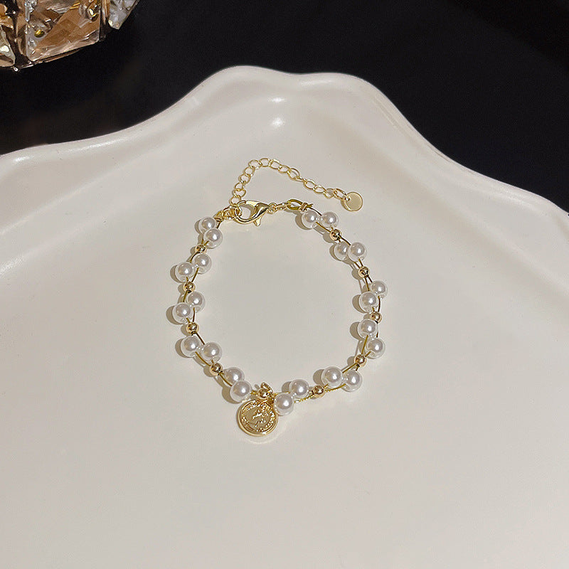 Pulsera versátil de perlas y flores de circón