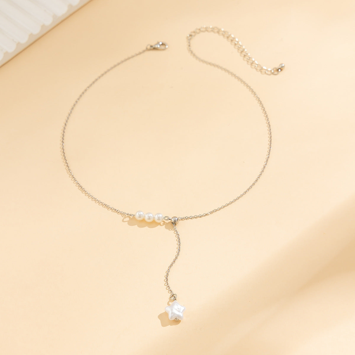 Collier à tirer conçu avec perle étoile à cinq branches