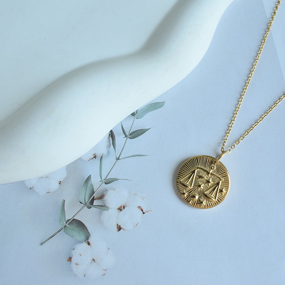 Collier de pièces de monnaie à douze constellations en relief de niche européenne et américaine