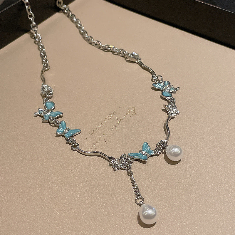 Collier de perles en strass papillon froid