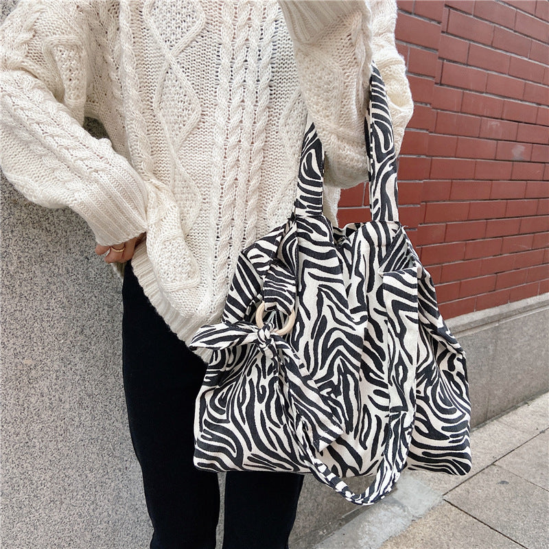 Sac messager rose rétro artistique simple de grande capacité