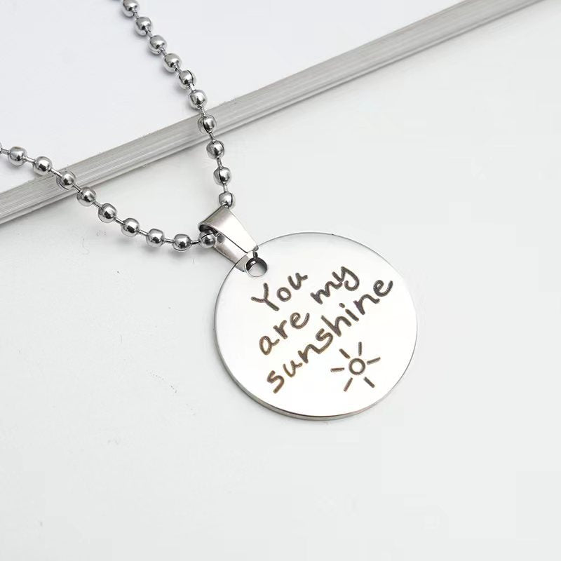 Collier cadeau de Festival de Noël avec lettrage rond en acier inoxydable