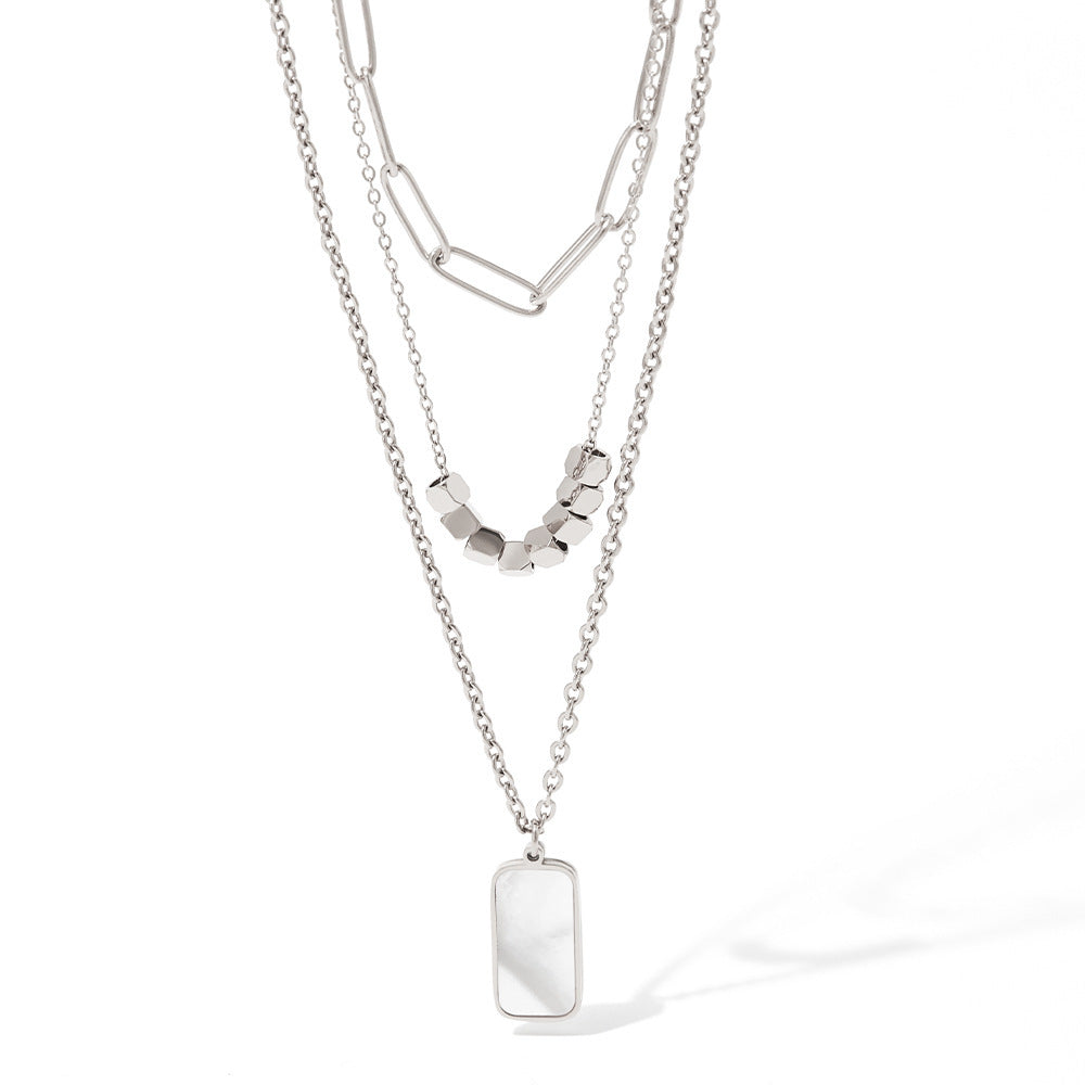 Collar de concha blanca rectangular hueco gemelo de tres capas