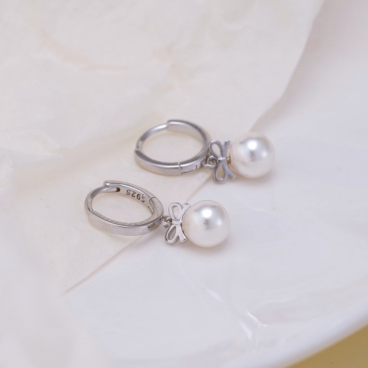 Boucles d'oreilles en perles artificielles avec nœud exquis