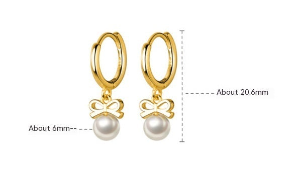 Boucles d'oreilles en perles artificielles avec nœud exquis