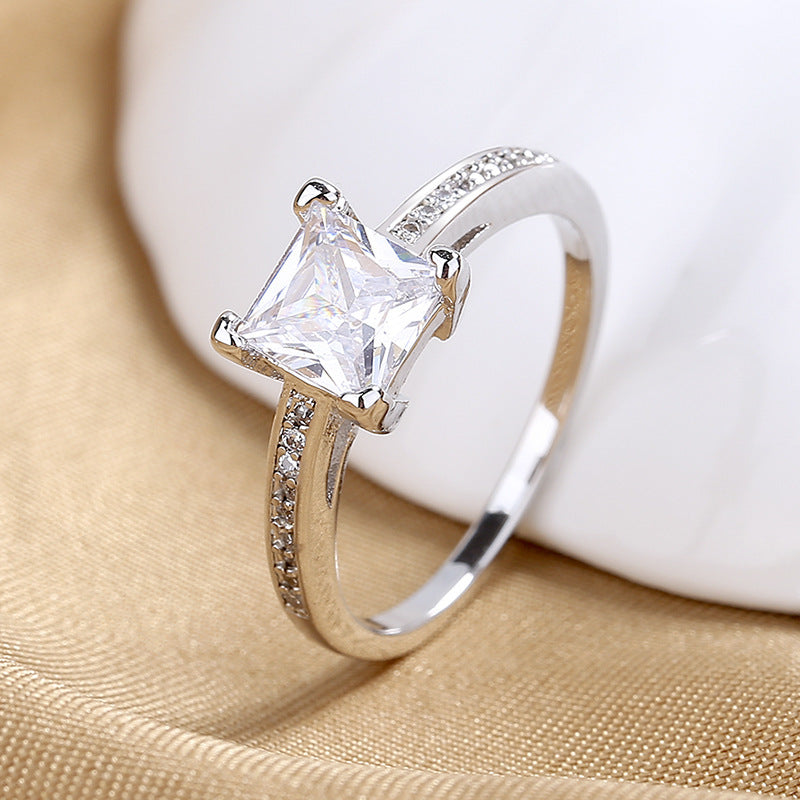 Anillo de diamantes de alta simulación de cuatro garras de moda simple para mujer