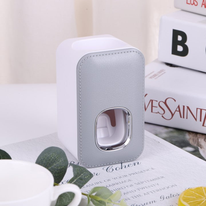 Dispensador automático de pasta de dientes montado en la pared