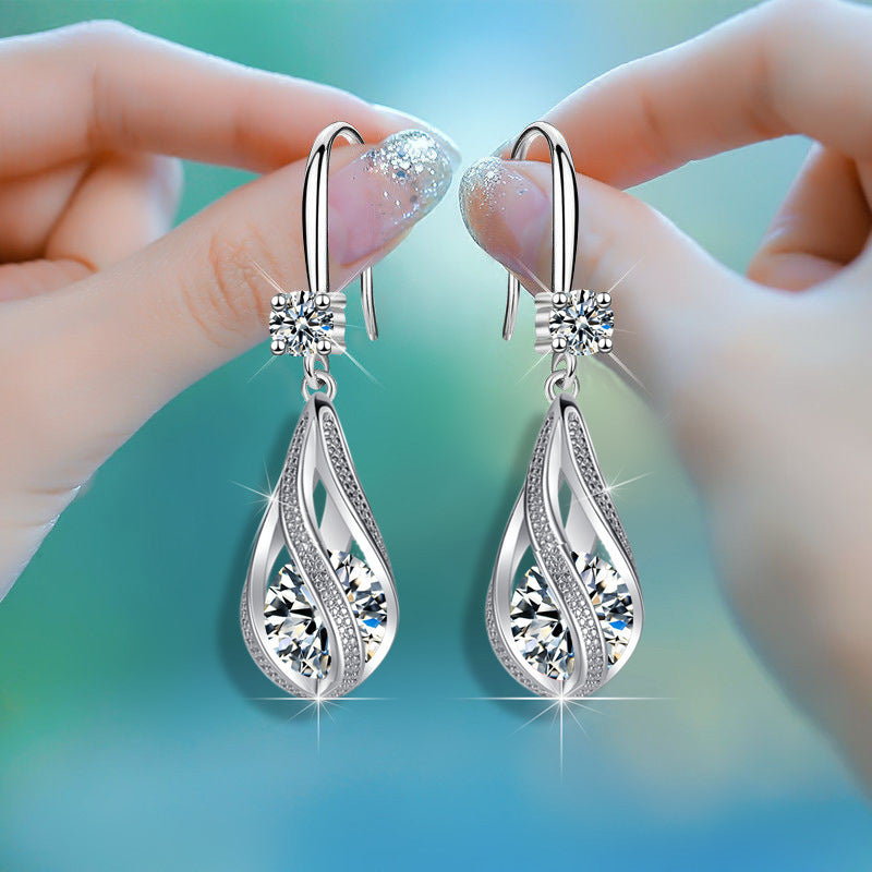 Boucles d'oreilles en forme de larme rotative pour femmes