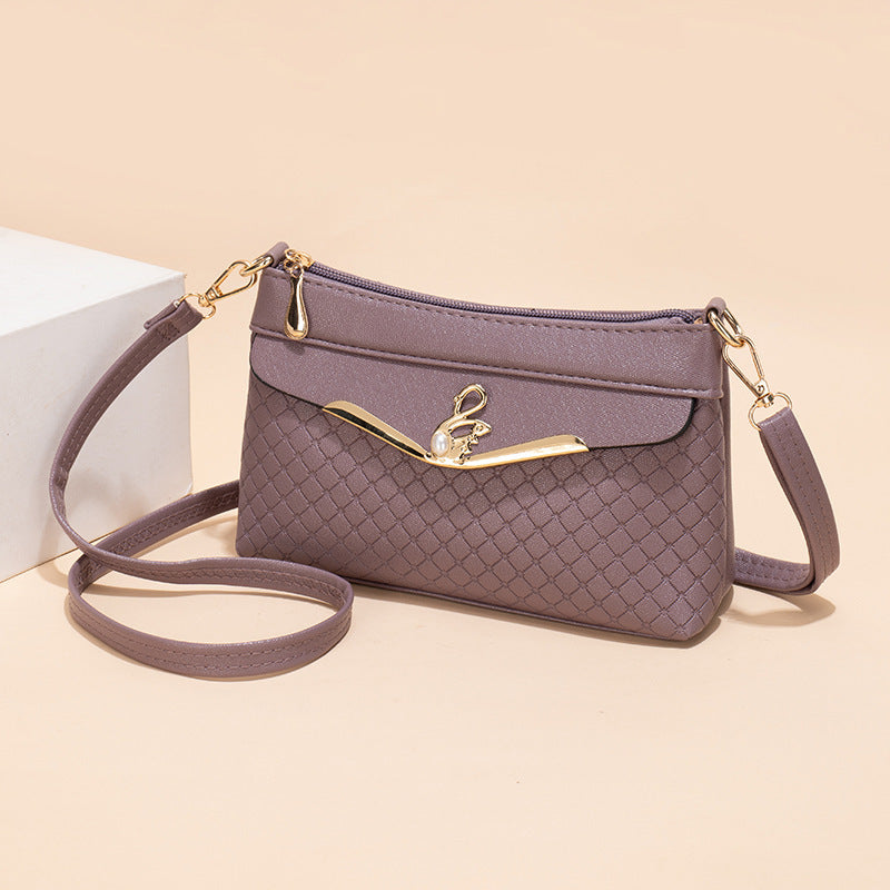 Práctico bolso bandolera con relieve Lingge