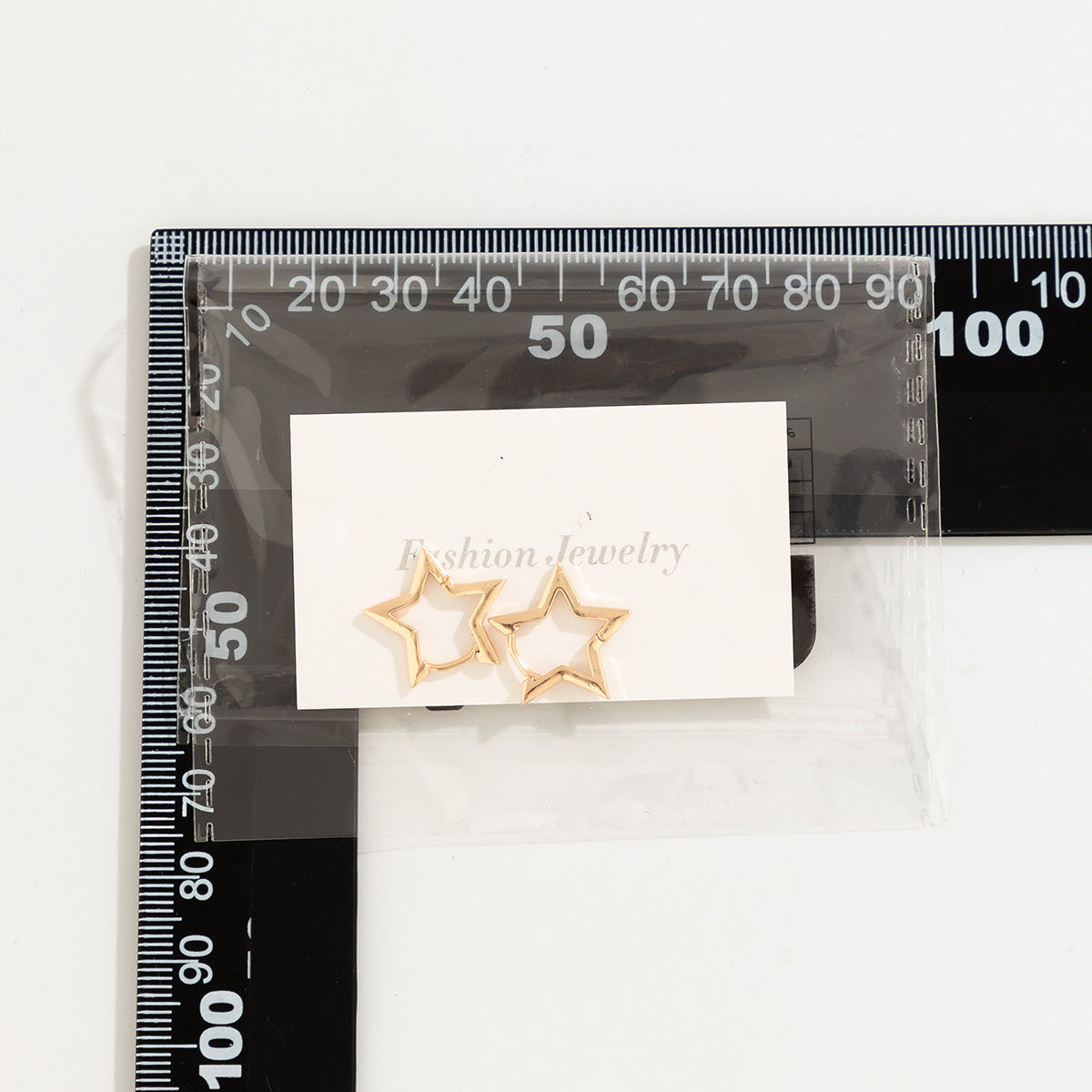 Clous d'oreilles étoiles géométriques en acier titane