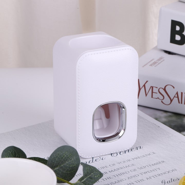 Dispensador automático de pasta de dientes montado en la pared