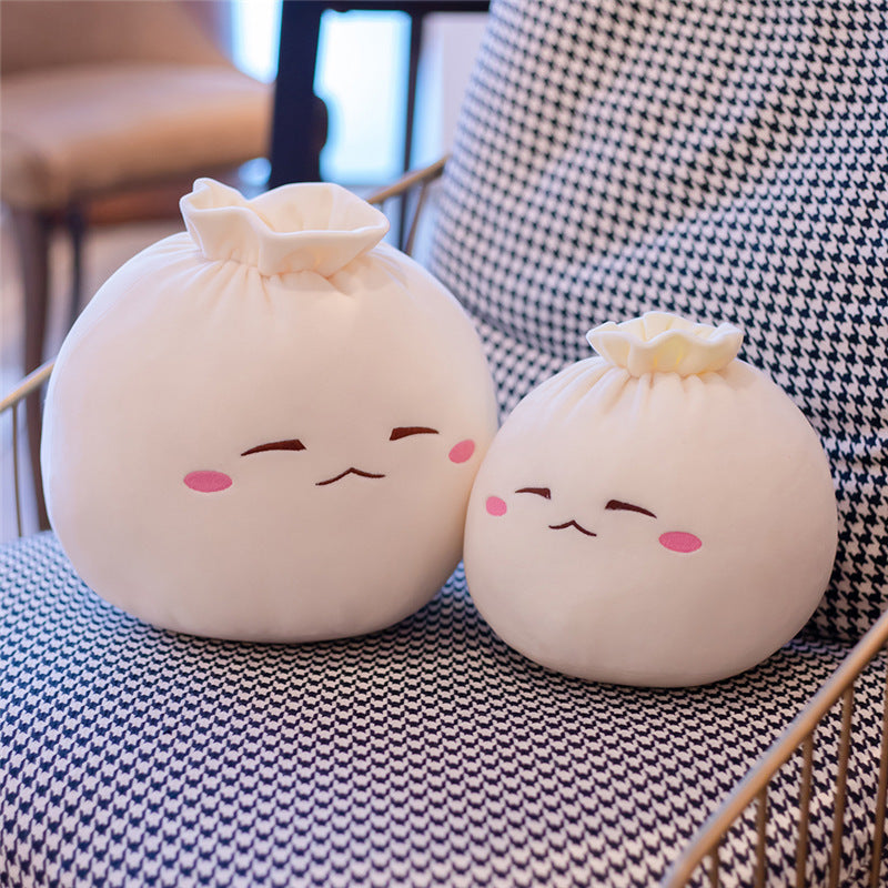 Expression douce et mignonne, un chignon en peluche, oreiller en pâte élastique