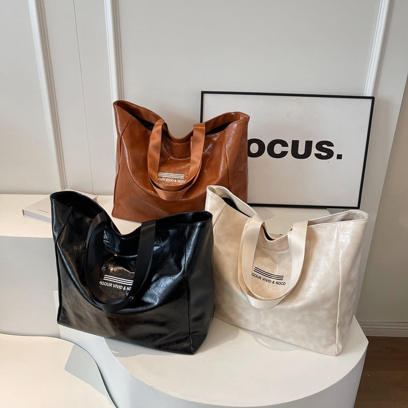 Bolso de mano de gran capacidad para mujer, bolsos de hombro sólidos versátiles a la moda, bolso de lujo de diseñador impermeable, bolso de viaje personalizado de tendencia