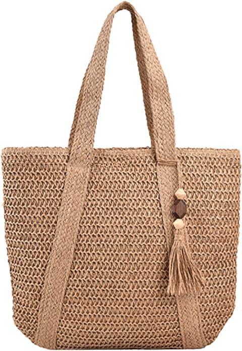 Bolso de paja para mujer con borlas tejidas en la playa