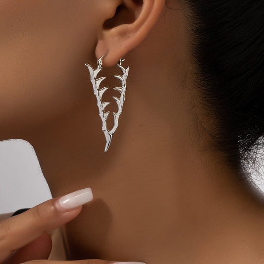Boucles d'oreilles creuses en forme d'épines de dents de serpent