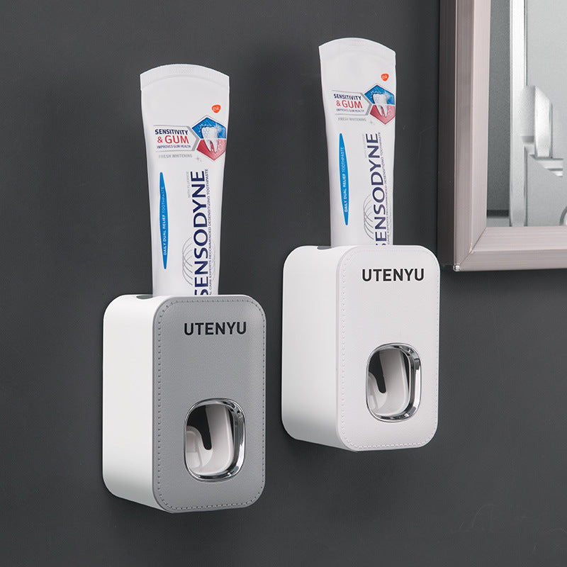 Dispensador automático de pasta de dientes montado en la pared
